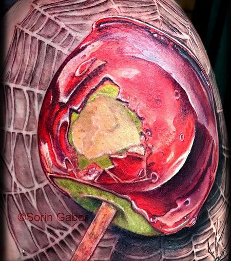 tattoos/ - realistic color candy apple on spiderweb tattoo  - 131438